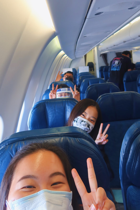friends on the flight with me! each with our own row.